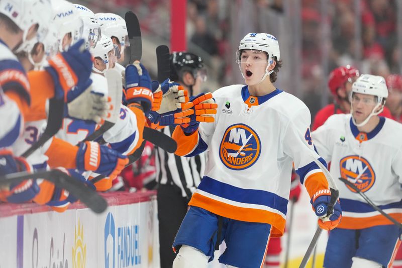 Oct 30, 2025; Raleigh, North Carolina, USA;  New York Islanders defenseman Matthew Schaefer (48) celebrates his goal against the Carolina Hurricanes during the first period at Lenovo Center. Mandatory Credit: James Guillory-Imagn Images
