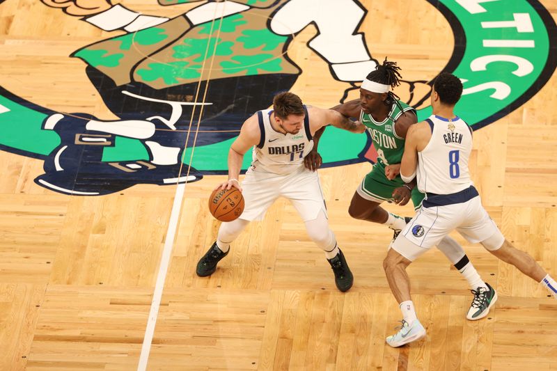 BOSTON, MA - JUNE 17: Jrue Holiday #4 of the Boston Celtics plays defense during the game  against Luka Doncic #77 of the Dallas Mavericks during Game 5 of the 2024 NBA Finals on June 17, 2024 at the TD Garden in Boston, Massachusetts. NOTE TO USER: User expressly acknowledges and agrees that, by downloading and or using this photograph, User is consenting to the terms and conditions of the Getty Images License Agreement. Mandatory Copyright Notice: Copyright 2024 NBAE  (Photo by Stephen Gosling/NBAE via Getty Images)