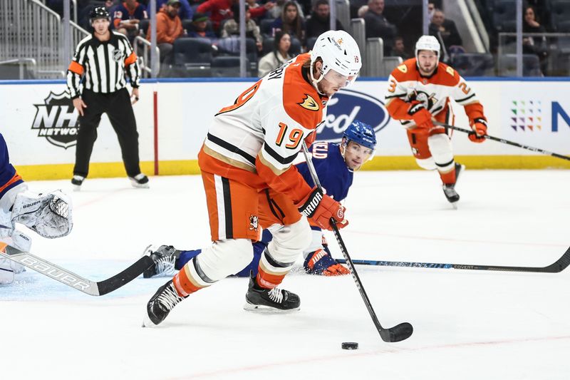 Oct 29, 2024; Elmont, New York, USA; Anaheim Ducks right wing Troy Terry (19) controls the puck in the first period against the New York Islanders at UBS Arena. Mandatory Credit: Wendell Cruz-Imagn Images