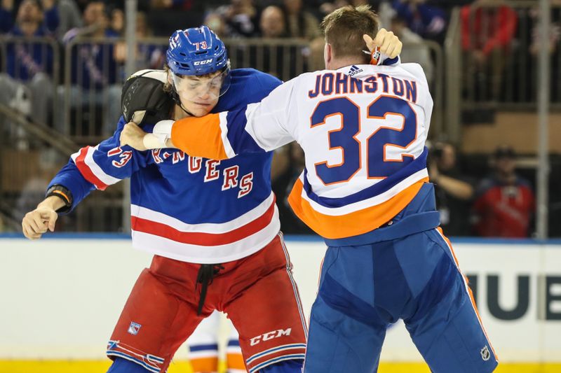 Sep 26, 2023; New York, New York, USA;  New York Rangers center Matt Rempe (73) fights New York Islanders left wing Ross Johnston (32) in the second period at Madison Square Garden. Mandatory Credit: Wendell Cruz-USA TODAY Sports