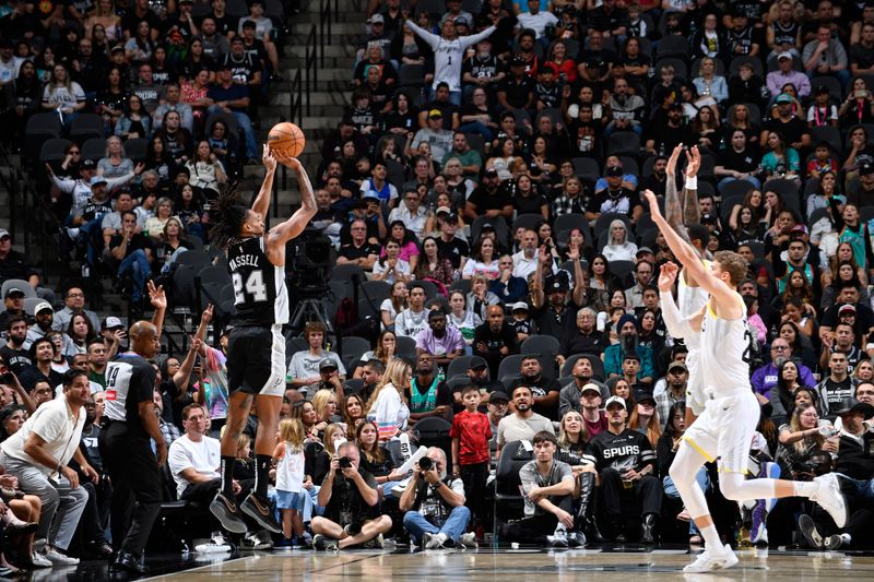 SAN ANTONIO, TX - NOVEMBER 9: Devin Vassell #24 of the San Antonio Spurs shoots a three point basket during the game against the Utah Jazz on November 9, 2024 at the Frost Bank Center in San Antonio, Texas. NOTE TO USER: User expressly acknowledges and agrees that, by downloading and or using this photograph, user is consenting to the terms and conditions of the Getty Images License Agreement. Mandatory Copyright Notice: Copyright 2024 NBAE (Photos by Logan Riely/NBAE via Getty Images)