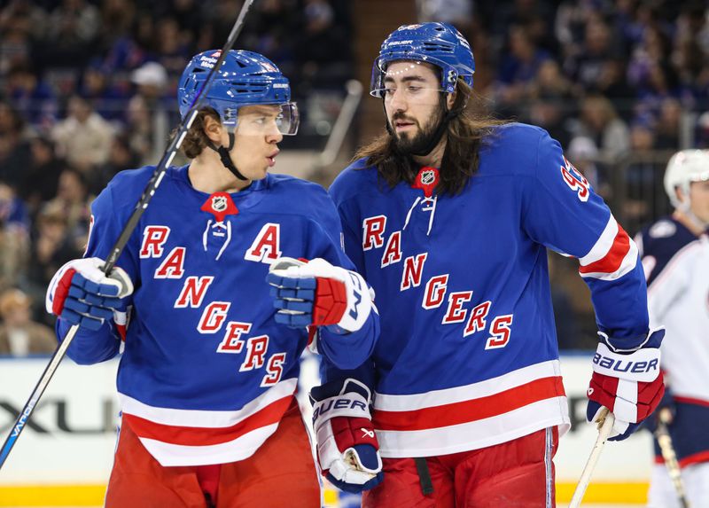 Jan 18, 2025; New York, New York, USA; New York Rangers center Mika Zibanejad (93) talks with New York Rangers left wing Artemi Panarin (10) before a face-off against the Columbus Blue Jackets during the first period at Madison Square Garden. Mandatory Credit: Danny Wild-Imagn Images