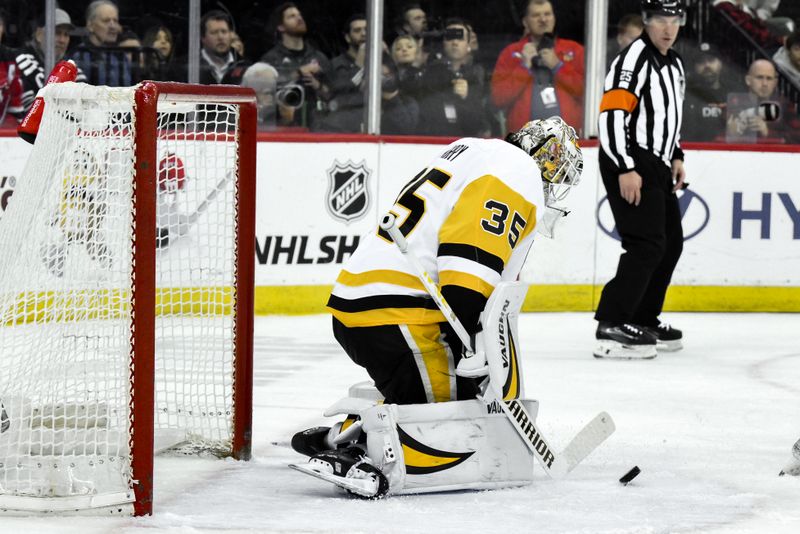 Apr 11, 2025; Newark, New Jersey, USA; Pittsburgh Penguins goaltender Tristan Jarry (35) makes a save against the New Jersey Devils during the second period at Prudential Center. Mandatory Credit: John Jones-Imagn Images