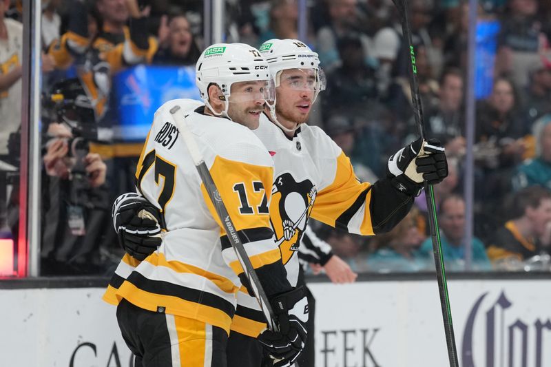 Nov 4, 2023; San Jose, California, USA; Pittsburgh Penguins right wing Reilly Smith (right) celebrates with right wing Bryan Rust (17) after scoring a goal against the San Jose Sharks during the first period at SAP Center at San Jose. Mandatory Credit: Darren Yamashita-USA TODAY Sports