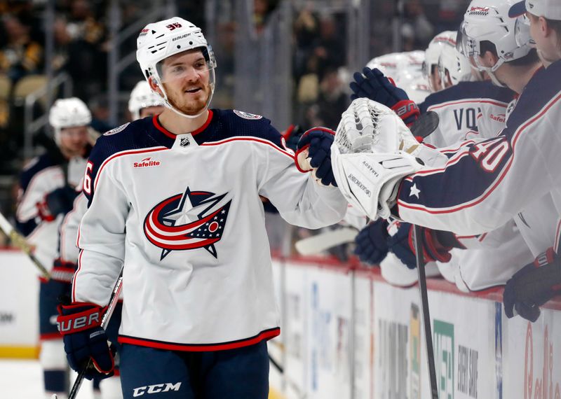 Mar 5, 2024; Pittsburgh, Pennsylvania, USA; Columbus Blue Jackets center Jack Roslovic (96) celebrates with the Blue Jackets bench after scoring a goal against the Pittsburgh Penguins during the third period at PPG Paints Arena. The Penguins won 5-3. Mandatory Credit: Charles LeClaire-USA TODAY Sports