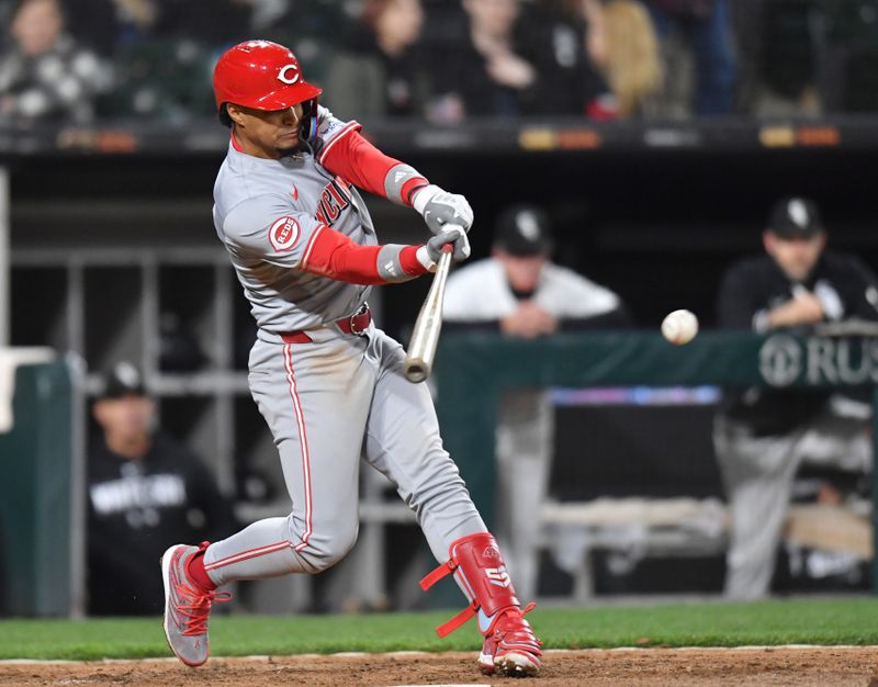 Apr 12, 2024; Chicago, Illinois, USA; Cincinnati Reds third base Santiago Espinal (4) hits a two-run single during the ninth inning against the Chicago White Sox at Guaranteed Rate Field. Mandatory Credit: Patrick Gorski-USA TODAY Sports
