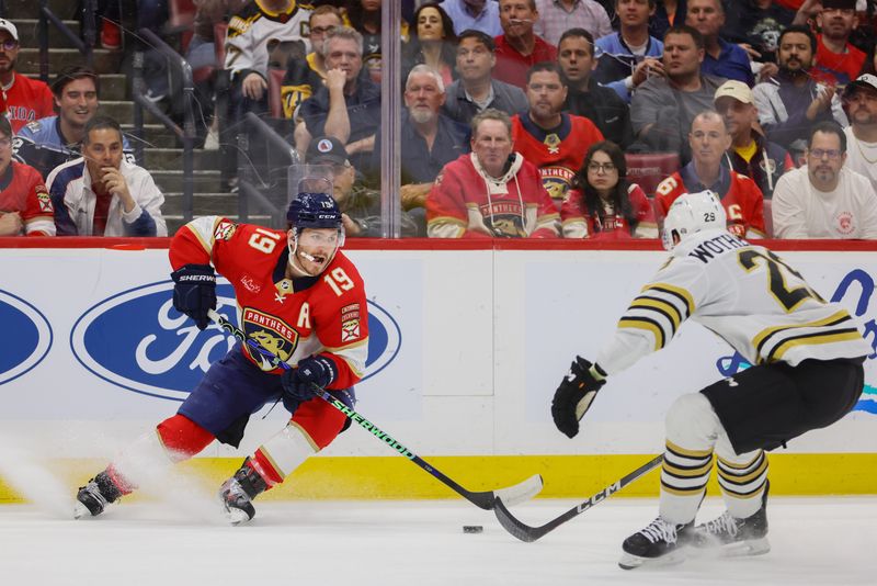 May 14, 2024; Sunrise, Florida, USA; Florida Panthers left wing Matthew Tkachuk (19) moves the puck against the Boston Bruins during the second period in game five of the second round of the 2024 Stanley Cup Playoffs at Amerant Bank Arena. Mandatory Credit: Sam Navarro-USA TODAY Sports