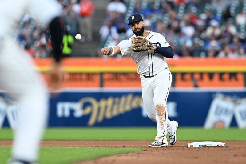 May 27, 2025; Detroit, Michigan, USA;  Detroit Tigers second baseman Gleyber Torres  (25) turns a double play against the San Francisco Giants in the eighth inning at Comerica Park. Mandatory Credit: Lon Horwedel-Imagn Images