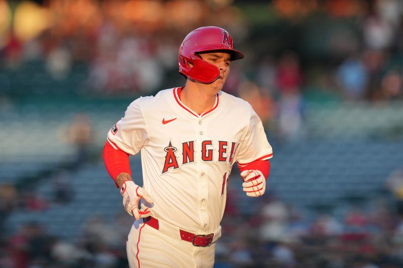 Jul 10, 2024; Anaheim, California, USA;  Los Angeles Angels center fielder Mickey Moniak (16) runs the bases after hitting a three-run home run in the second inning against the Texas Rangers at Angel Stadium. Mandatory Credit: Kirby Lee-USA TODAY Sports