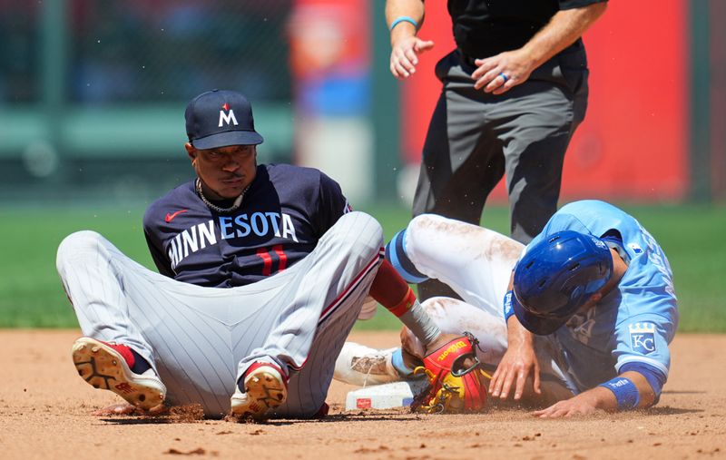 Jul 30, 2023; Kansas City, Missouri, USA; Kansas City Royals second baseman Michael Massey (19) steals second base against Minnesota Twins second baseman Jorge Polanco (11) during the fourth inning at Kauffman Stadium. Mandatory Credit: Jay Biggerstaff-USA TODAY Sports