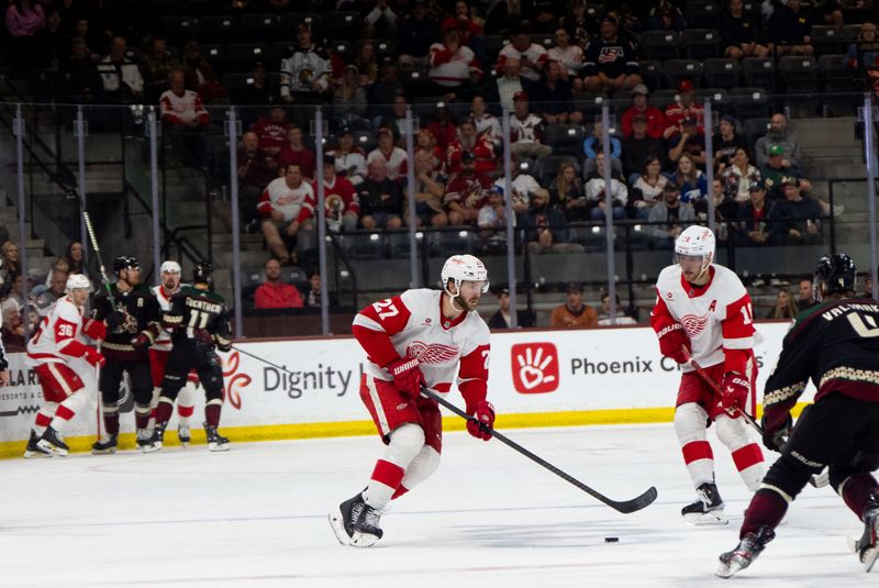 Mar 8, 2024; Tempe, Arizona, USA; Detroit Red Wings forward Michael Rasmussen (27) breaks away and works the puck down the ice in the third period during a game against the Arizona Coyotes at Mullett Arena. Mandatory Credit: Allan Henry-USA TODAY Sports