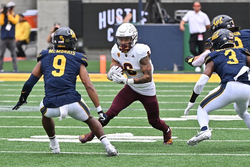 Sep 30, 2023; Berkeley, California, USA; Arizona State Sun Devils wide receiver Giovanni Sanders (6) evades California Golden Bears defensive backs Patrick McMorris (9) and Nohl Williams (3) during the first quarter at California Memorial Stadium. Mandatory Credit: Robert Edwards-USA TODAY Sports