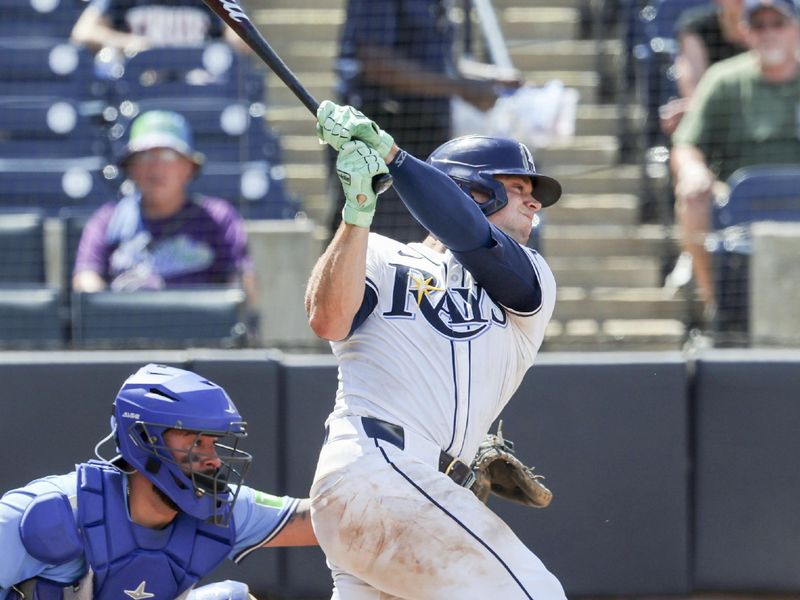 May 25, 2025; St. Petersburg, Florida, USA;  Tampa Bay Rays catcher Ben Rortvedt (30) hits a sacrifice RBI during the seventh inning against the Toronto Blue Jays at George M. Steinbrenner Field. Mandatory Credit: Kim Klement Neitzel-Imagn Images