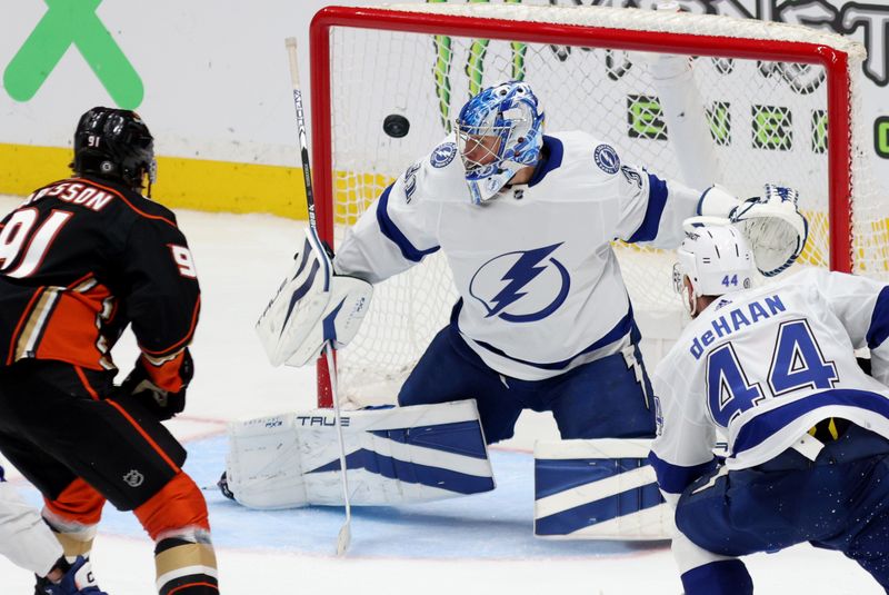 Mar 24, 2024; Anaheim, California, USA; Tampa Bay Lightning goaltender Jonas Johansson (31) makes a save against Anaheim Ducks center Leo Carlsson (91) during the third period at Honda Center. Mandatory Credit: Jason Parkhurst-USA TODAY Sports