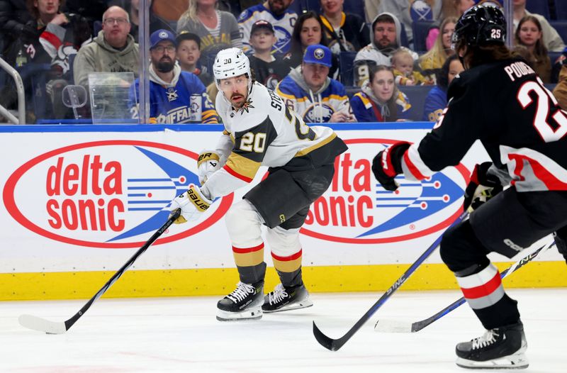 Mar 2, 2024; Buffalo, New York, USA;  Buffalo Sabres defenseman Owen Power (25) watches as Vegas Golden Knights center Chandler Stephenson (20) looks to make a pass during the first period at KeyBank Center. Mandatory Credit: Timothy T. Ludwig-USA TODAY Sports