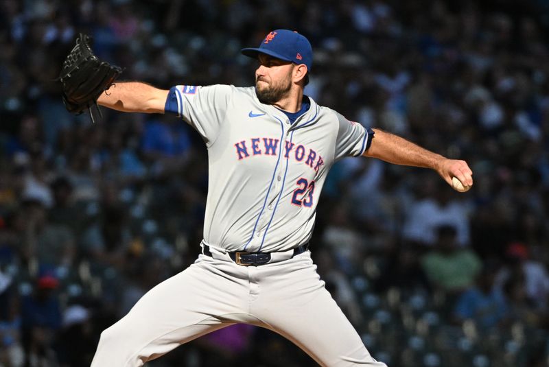 Sep 29, 2024; Milwaukee, Wisconsin, USA; New York Mets pitcher David Peterson (23) delivers a pitch against the Milwaukee Brewers in the fourth inning at American Family Field. Mandatory Credit: Michael McLoone-Imagn Images