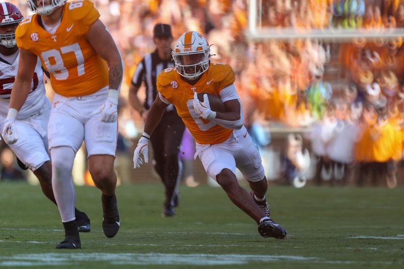 Oct 19, 2024; Knoxville, Tennessee, USA; Tennessee Volunteers running back Dylan Sampson (6) runs the ball against the Alabama Crimson Tide during the first quarter at Neyland Stadium. Mandatory Credit: Randy Sartin-Imagn Images