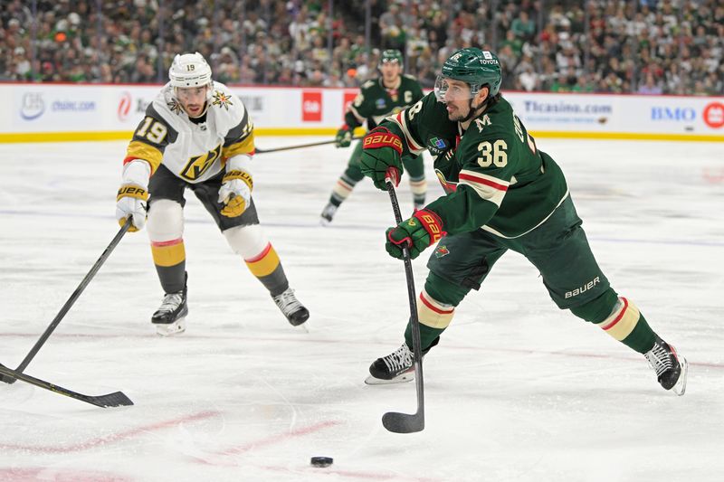 May 1, 2025; Saint Paul, Minnesota, USA;  Minnesota Wild forward Mats Zuccarello (36) takes a shot on goal as Vegas Golden Knights forward Reilly Smith (19) defends during the second period in game six of the first round of the 2025 Stanley Cup Playoffs at Xcel Energy Center. Mandatory Credit: Nick Wosika-Imagn Images