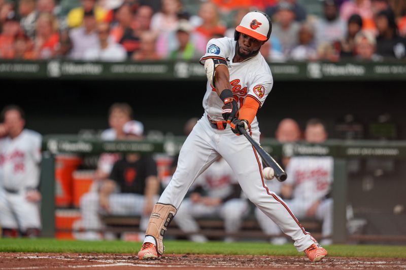 Jun 26, 2024; Baltimore, Maryland, USA; Baltimore Orioles outfielder Cedric Mullins (31) hits a home run during the seventh inning against the Cleveland Guardians at Oriole Park at Camden Yards. Mandatory Credit: Reggie Hildred-USA TODAY Sports