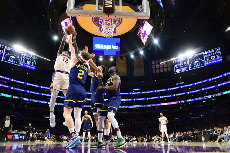 LOS ANGELES, CA - MACH 16: Taurean Prince #12 of the Los Angeles Lakers drives to the basket during the game against the Golden State Warriors on March 16, 2024 at Crypto.Com Arena in Los Angeles, California. NOTE TO USER: User expressly acknowledges and agrees that, by downloading and/or using this Photograph, user is consenting to the terms and conditions of the Getty Images License Agreement. Mandatory Copyright Notice: Copyright 2024 NBAE (Photo by Adam Pantozzi/NBAE via Getty Images)