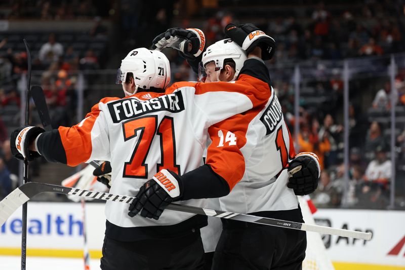 Nov 10, 2023; Anaheim, California, USA; Philadelphia Flyers center Sean Couturier (14) celebrates with right wing Tyson Foerster (71) after scoring a goal during the first period against the Anaheim Ducks at Honda Center. Mandatory Credit: Kiyoshi Mio-USA TODAY Sports