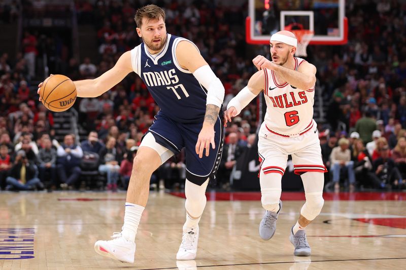 CHICAGO, ILLINOIS - MARCH 11: Luka Doncic #77 of the Dallas Mavericks drives to the basket against Alex Caruso #6 of the Chicago Bulls during the first half at the United Center on March 11, 2024 in Chicago, Illinois. NOTE TO USER: User expressly acknowledges and agrees that, by downloading and or using this photograph, User is consenting to the terms and conditions of the Getty Images License Agreement.  (Photo by Michael Reaves/Getty Images)