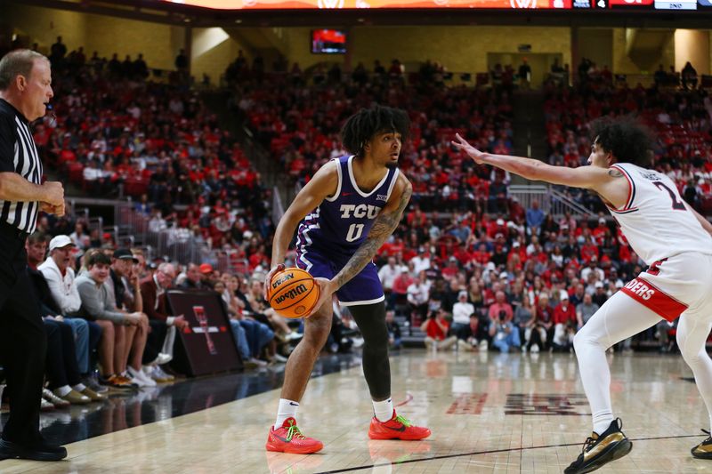 Feb 20, 2024; Lubbock, Texas, USA;  TCU Horned Frogs guard Micah Peavy (0) looks to pass the ball around Texas Tech Red Raiders guard Pop Isaacs (2) in the second half at United Supermarkets Arena. Mandatory Credit: Michael C. Johnson-USA TODAY Sports