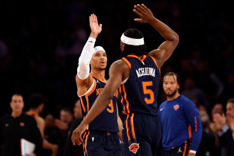 NEW YORK, NEW YORK - JANUARY 25: Josh Hart #3 celebrates with Precious Achiuwa #5 of the New York Knicks during the first half against the Denver Nuggets at Madison Square Garden on January 25, 2024 in New York City. NOTE TO USER: User expressly acknowledges and agrees that, by downloading and/or using this Photograph, user is consenting to the terms and conditions of the Getty Images License Agreement. (Photo by Sarah Stier/Getty Images)