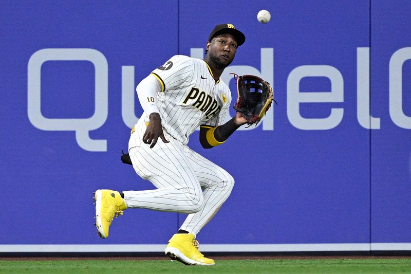 Jun 11, 2024; San Diego, California, USA; San Diego Padres left fielder Jurickson Profar (10) catches a line drive hit by Oakland Athletics designated hitter Brent Rooker (not pictured) during the fifth inning at Petco Park. Mandatory Credit: Orlando Ramirez-USA TODAY Sports