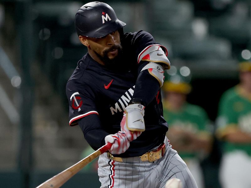 Jun 3, 2025; West Sacramento, California, USA; Minnesota Twins center fielder Byron Buxton (25) hits a double against the Athletics during the sixth inning at Sutter Health Park. Mandatory Credit: Dennis Lee-Imagn Images
