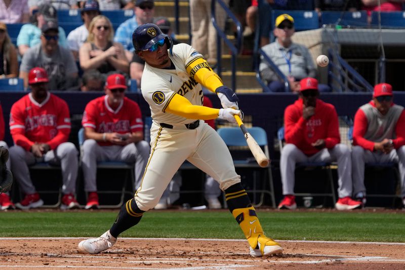 Mar 18, 2024; Phoenix, Arizona, USA; Milwaukee Brewers catcher William Contreras (24) hits against the Los Angeles Angels in the first inning at American Family Fields of Phoenix. Mandatory Credit: Rick Scuteri-USA TODAY Sports