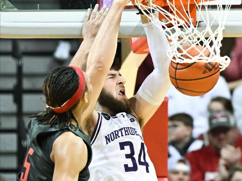 Feb 18, 2024; Bloomington, Indiana, USA;  Northwestern Wildcats center Matthew Nicholson (34) dunks the ball past Indiana Hoosiers forward Malik Reneau (5) during the first half at Simon Skjodt Assembly Hall. Mandatory Credit: Robert Goddin-USA TODAY Sports