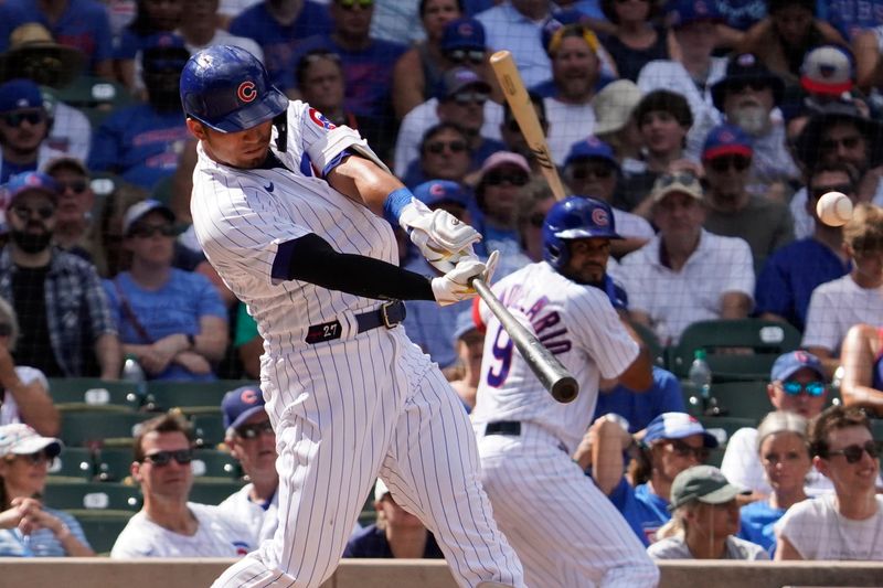 Sep 4, 2023; Chicago, Illinois, USA; Chicago Cubs right fielder Seiya Suzuki (27) hits a one run double against the San Francisco Giants during the seventh inning at Wrigley Field. Mandatory Credit: David Banks-USA TODAY Sports