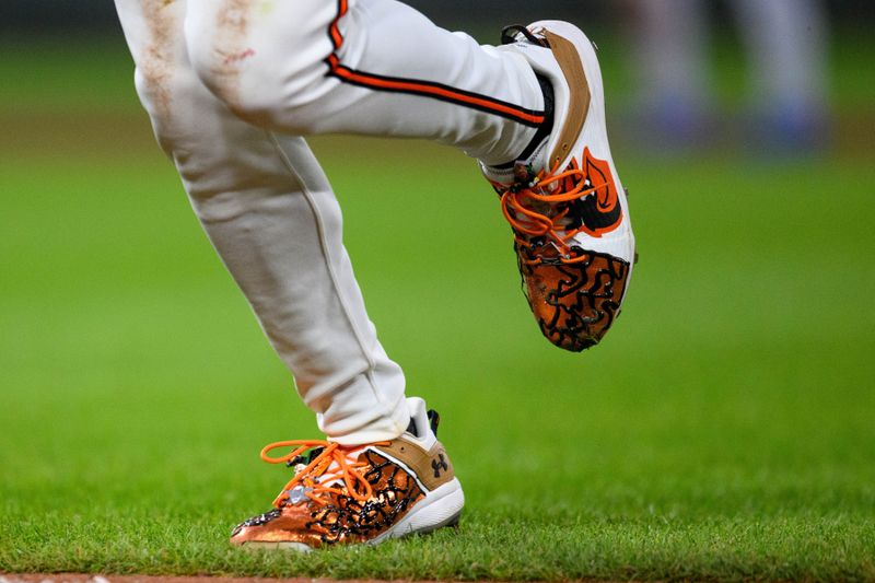 Jun 30, 2024; Baltimore, Maryland, USA; A detailed view of shoes worn by Baltimore Orioles shortstop Gunnar Henderson (2) during the fifth inning against the Texas Rangers at Oriole Park at Camden Yards. Mandatory Credit: Reggie Hildred-USA TODAY Sports