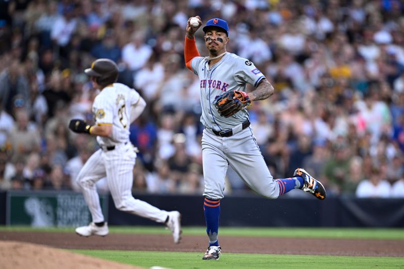 Aug 24, 2024; San Diego, California, USA; New York Mets third baseman Mark Vientos (27) throws to first base on a ground out by San Diego Padres first baseman Luis Arraez (not pictured) during the fifth inning at Petco Park. Mandatory Credit: Orlando Ramirez-USA TODAY Sports