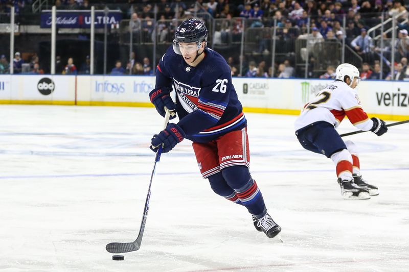 Mar 23, 2024; New York, New York, USA; New York Rangers left wing Jimmy Vesey (26) controls the puck in the third period against the Florida Panthers at Madison Square Garden. Mandatory Credit: Wendell Cruz-USA TODAY Sports