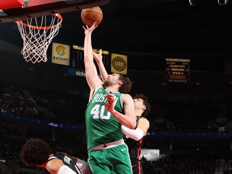 PORTLAND, OR - MARCH 23:  Luke Kornet #40 of the Boston Celtics drives to the basket during the game against the Portland Trail Blazers  on March 23, 2025 at the Moda Center Arena in Portland, Oregon. NOTE TO USER: User expressly acknowledges and agrees that, by downloading and or using this photograph, user is consenting to the terms and conditions of the Getty Images License Agreement. Mandatory Copyright Notice: Copyright 2025 NBAE (Photo by Cameron Browne/NBAE via Getty Images)