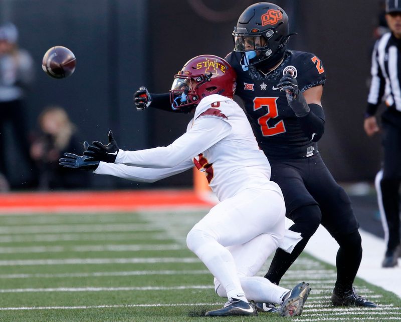 Nov 12, 2022; Stillwater, Oklahoma, USA;  Iowa State Cyclones wide receiver Xavier Hutchinson (8) makes a reception against Oklahoma State Cowboys cornerback Korie Black (2) in the third quarter at Boone Pickens Stadium. OSU won 20-14. Mandatory Credit: Sarah Phipps-USA TODAY Sports