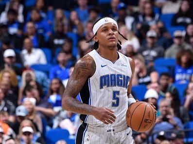 ORLANDO, FL - NOVEMBER 26: Paolo Banchero #5 of the Orlando Magic dribbles the ball during the game against the Charlotte Hornets on November 26, 2023 at Amway Center in Orlando, Florida. NOTE TO USER: User expressly acknowledges and agrees that, by downloading and or using this photograph, User is consenting to the terms and conditions of the Getty Images License Agreement. Mandatory Copyright Notice: Copyright 2023 NBAE (Photo by Gary Bassing/NBAE via Getty Images)