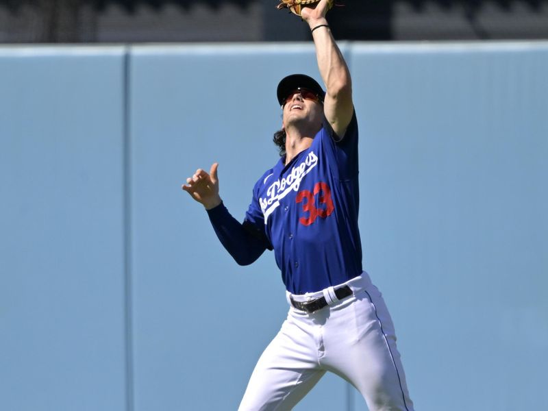 Aug 13, 2023; Los Angeles, California, USA; Los Angeles Dodgers center fielder James Outman (33) makes an out off a fly ball hit by Colorado Rockies catcher Elias Diaz (35) in the ninth inning at Dodger Stadium. Mandatory Credit: Jayne Kamin-Oncea-USA TODAY Sports