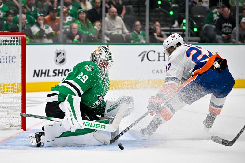 Oct 12, 2024; Dallas, Texas, USA; Dallas Stars goaltender Jake Oettinger (29) stops a breakaway shot by New York Islanders left wing Anders Lee (27) during the third period at the American Airlines Center. Mandatory Credit: Jerome Miron-Imagn Images