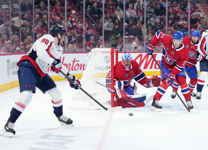 Feb 28, 2026; Montreal, Quebec, CAN;Montreal Canadiens goalie Jakub Dobes (75) stops Washington Capitals forward Pierre-Luc Dubois (80) withvthe help of teammate defenseman Kaiden Guhle (21) during the first period at the Bell Centre. Mandatory Credit: Eric Bolte-Imagn Images