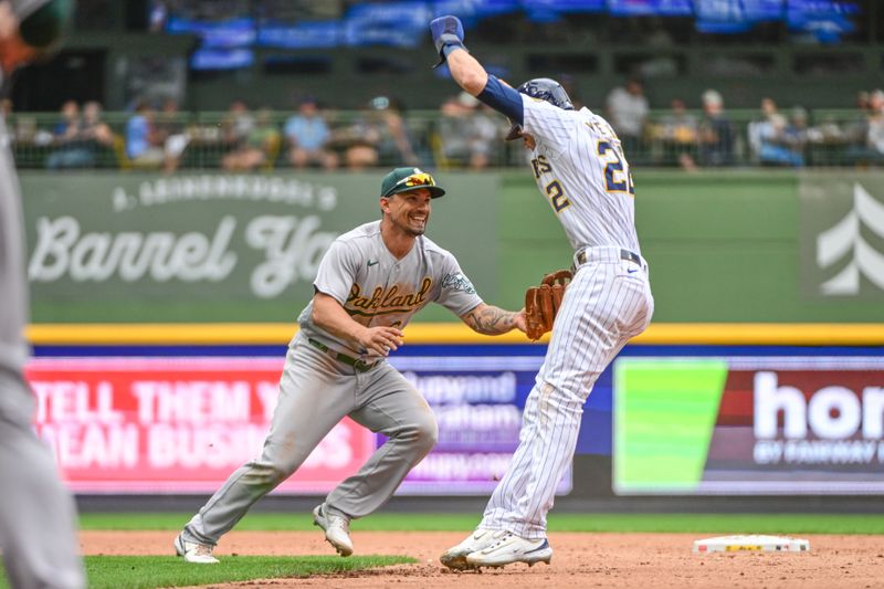 Jun 10, 2023; Milwaukee, Wisconsin, USA; Oakland Athletes second baseman Jace Peterson (6) tags out Milwaukee Brewers left fielder Christian Yelich (22) after he was picked off first base in the third inning at American Family Field. Mandatory Credit: Benny Sieu-USA TODAY Sports