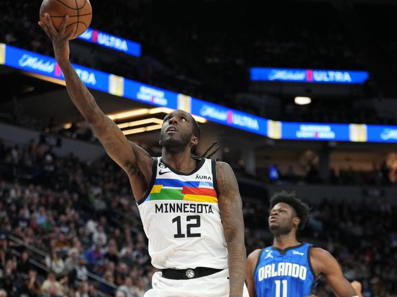 MINNEAPOLIS, MN -  FEBRUARY 3:  Taurean Prince #12 of the Minnesota Timberwolves drives to the basket during the game against the Orlando Magic on February 3, 2023 at Target Center in Minneapolis, Minnesota. NOTE TO USER: User expressly acknowledges and agrees that, by downloading and or using this Photograph, user is consenting to the terms and conditions of the Getty Images License Agreement. Mandatory Copyright Notice: Copyright 2022 NBAE (Photo by Jordan Johnson/NBAE via Getty Images)