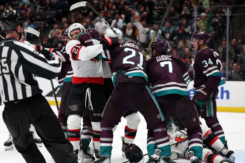 Mar 6, 2024; Anaheim, California, USA;  Anaheim Ducks center Isac Lundestrom (21) pushes Ottawa Senators right wing Mathieu Joseph (21) during the third period at Honda Center. Mandatory Credit: Kiyoshi Mio-USA TODAY Sports