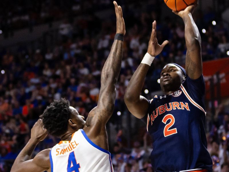 Feb 10, 2024; Gainesville, Florida, USA; Auburn Tigers forward Jaylin Williams (2) shoots the ball over Florida Gators forward Tyrese Samuel (4) during the first half at Exactech Arena at the Stephen C. O'Connell Center. Mandatory Credit: Matt Pendleton-USA TODAY Sports