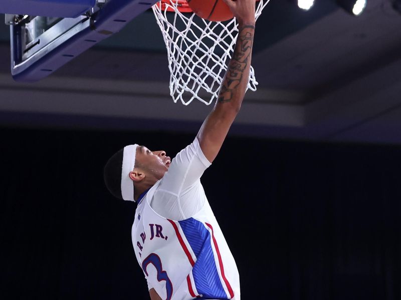 Nov 25, 2022; Paradise Island, BAHAMAS; Kansas Jayhawks guard Dajuan Harris Jr. (3) scores during the first half against the Tennessee Volunteers at Imperial Arena. Mandatory Credit: Kevin Jairaj-USA TODAY Sports