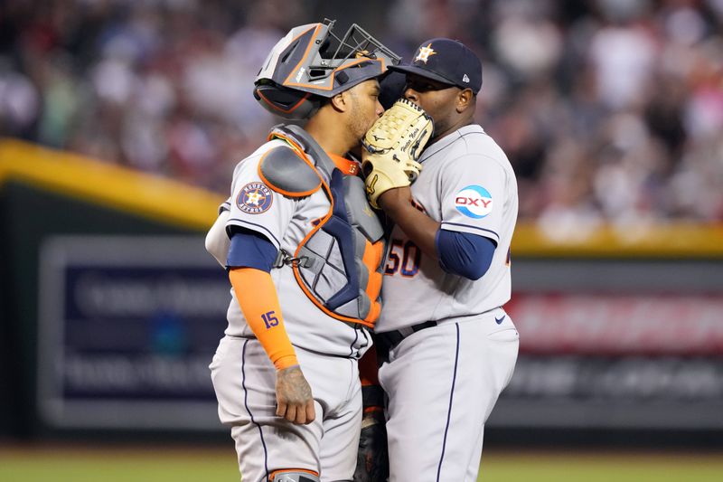 Sep 30, 2023; Phoenix, Arizona, USA; Houston Astros catcher Martin Maldonado (15) talks with Houston Astros relief pitcher Hector Neris (50) during the seventh inning of the game against the Arizona Diamondbacks at Chase Field. Mandatory Credit: Joe Camporeale-USA TODAY Sports