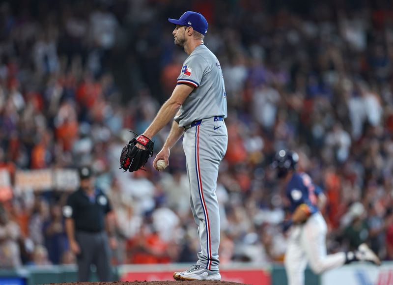 Jul 14, 2024; Houston, Texas, USA; Texas Rangers starting pitcher Max Scherzer (31) reacts and Houston Astros center fielder Jake Meyers (6) rounds the bases after hitting a home run during the third inning at Minute Maid Park. Mandatory Credit: Troy Taormina-USA TODAY Sports