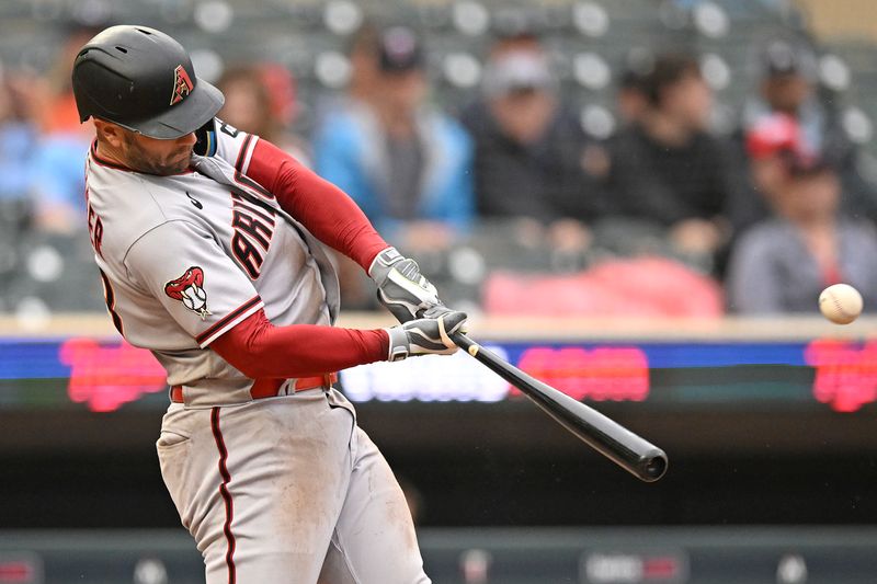 Aug 6, 2023; Minneapolis, Minnesota, USA;  Arizona Diamondbacks infielder Christian Walker (53) hits a solo home run against the Minnesota Twins during the ninth inning at Target Field. Mandatory Credit: Nick Wosika-USA TODAY Sports